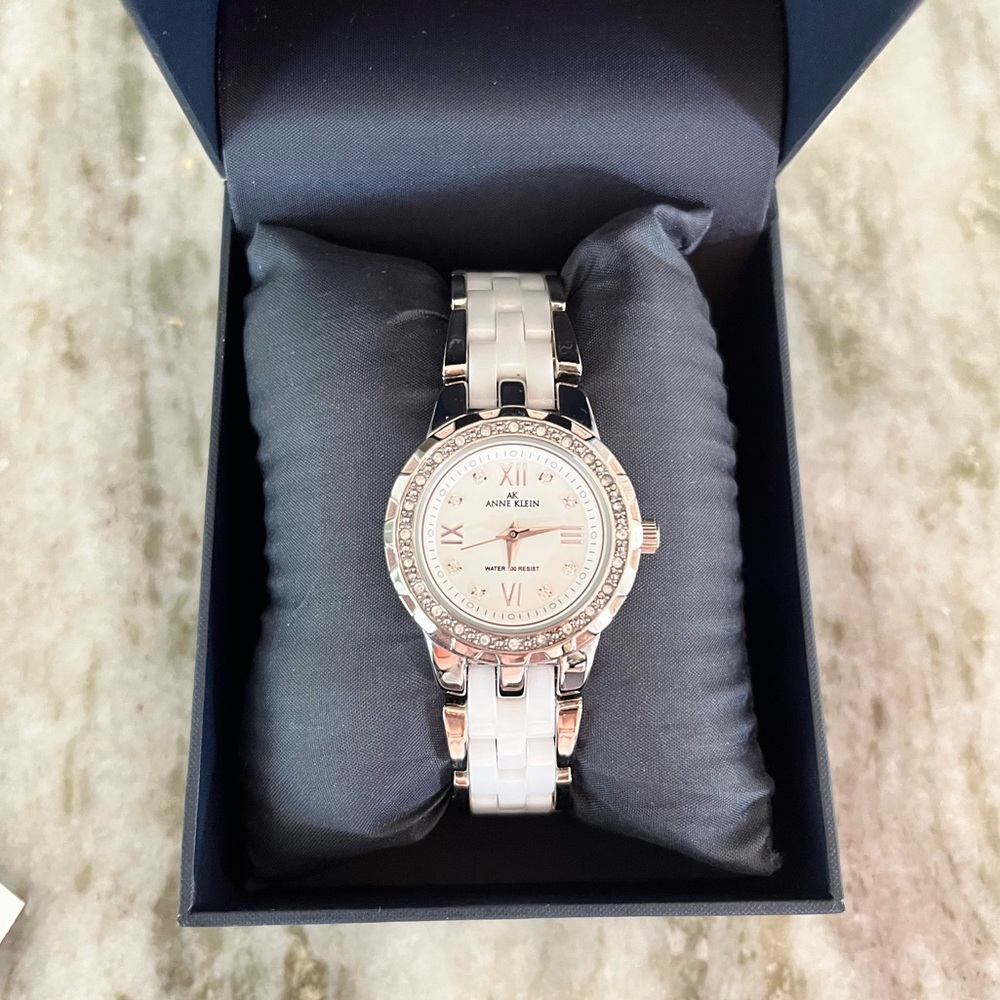Anne Klein women’s silver, white ceramic, and cubic zirconia bracelet watch